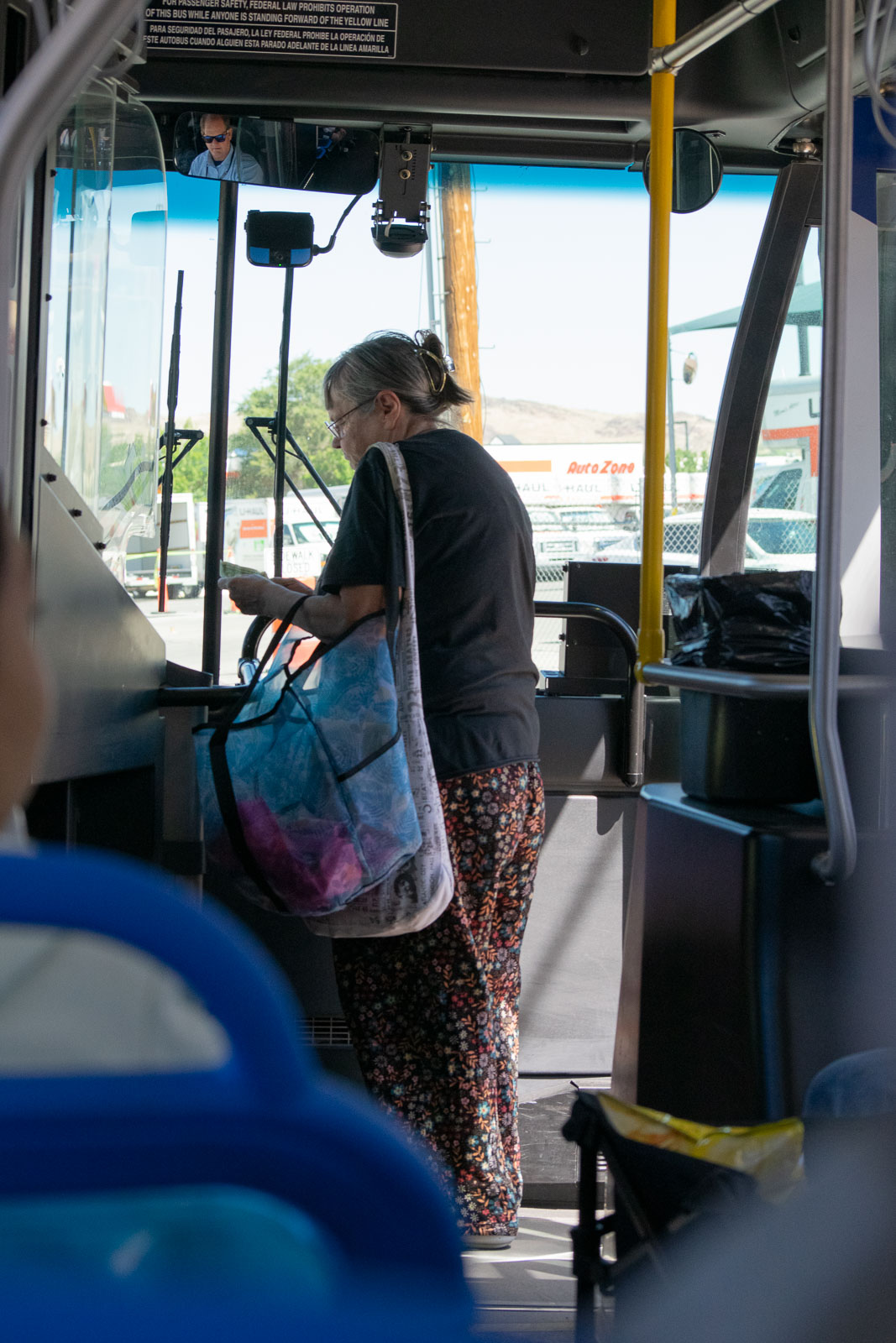 Passenger paying for ticket in the bus