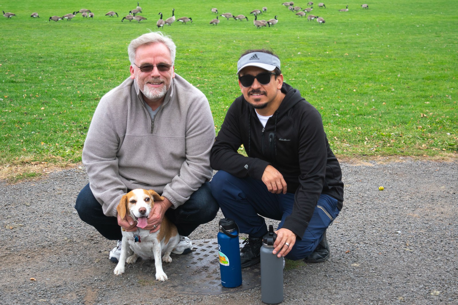 friends taking dog for walk